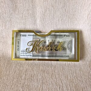 A personalized Rakhi money envelope featuring the custom name 'Kashish' in beautiful gold script, making it an ideal, thoughtful gift for a sister.