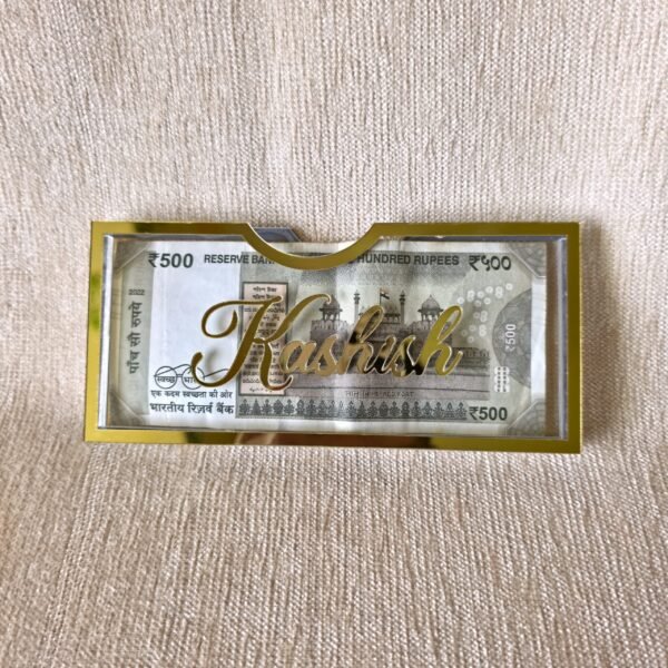 A personalized Rakhi money envelope featuring the custom name 'Kashish' in beautiful gold script, making it an ideal, thoughtful gift for a sister.
