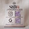 Front view of a personalized business QR code stand in matte and rose gold for 'Shah Fragrances', showing Instagram and Google review QR codes.