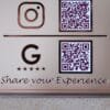 Close-up of the Google review section on a custom QR code sign, showing the Google 'G' logo, five stars, and a QR code for customer feedback.