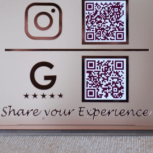 Close-up of the Google review section on a custom QR code sign, showing the Google 'G' logo, five stars, and a QR code for customer feedback.