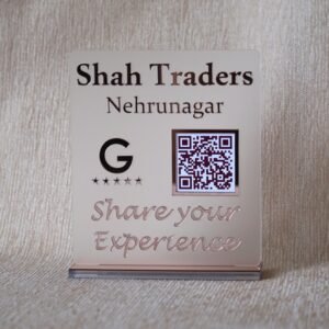 Custom acrylic QR code stand for 'Shah Traders Nehrunagar' in a matte and rose gold finish, designed to increase Google Reviews.