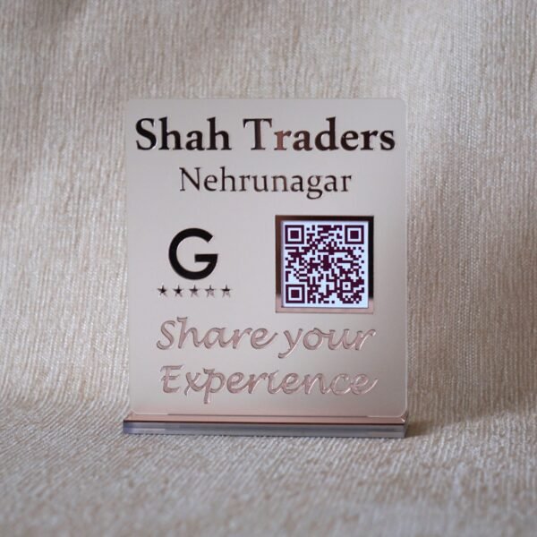 Custom acrylic QR code stand for 'Shah Traders Nehrunagar' in a matte and rose gold finish, designed to increase Google Reviews.