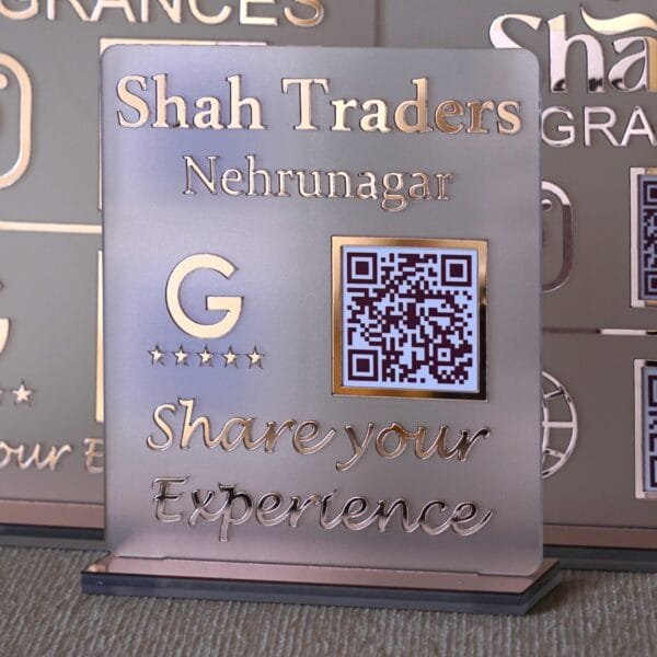 A custom Google Review QR code stand for 'Shah Traders' displayed on a counter, showing its premium matte finish in a business setting.