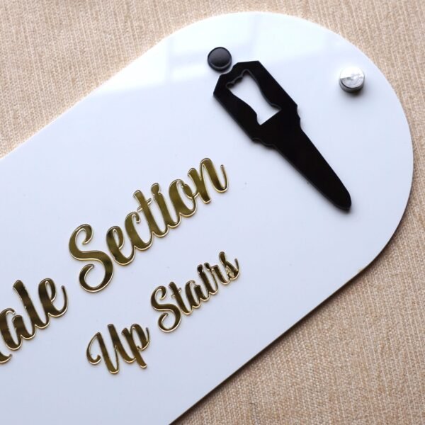 Overhead angled view of the 'Male Section' acrylic signboard, showcasing the 3D effect of the lettering and icon.