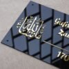 DSC08175 Close-up shot of the Masha'Allah Arabic calligraphy on a custom Islamic nameplate, highlighting the glossy, premium golden finish of the lettering.