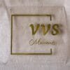 A professional gold and transparent acrylic logo sign for an office or business, showcasing its minimalist and modern design.