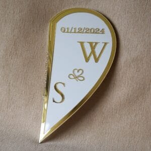 The back of the foldable Nikah board showing one half of the heart, personalised with the initials 'W & S' and the wedding date.