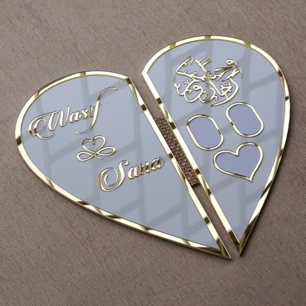 DSC08355 The open heart-shaped Nikah board under cool lighting, giving the white acrylic a modern, greyish tint and highlighting the reflective gold.
