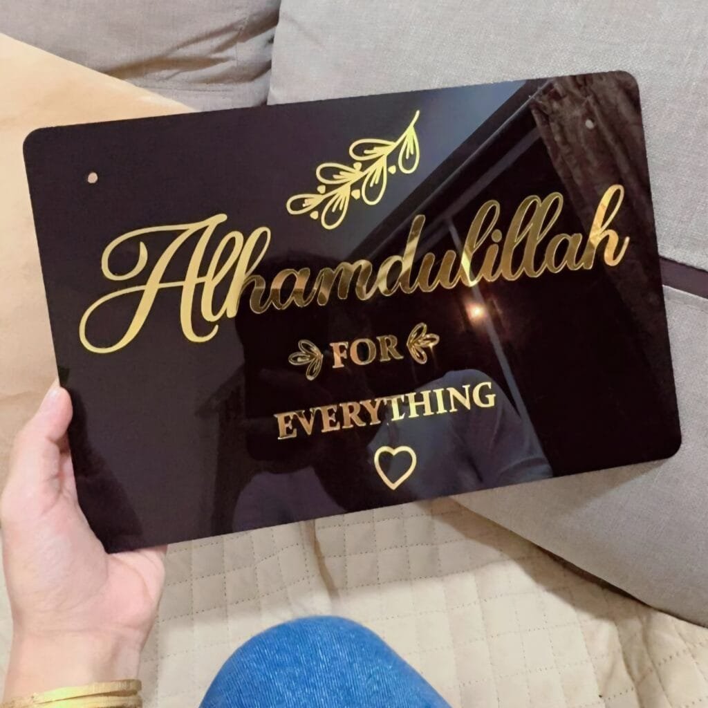 islamic wall hanging in black and golden