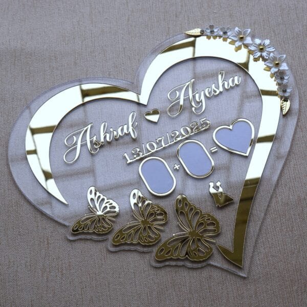 1751816649305 An angled view of the personalized acrylic wedding plaque, showing the reflective quality of the gold mirror details.