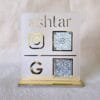 Front-facing view of the premium matte and gold acrylic QR code stand for Instagram and Google, customized for the brand 'ashtar'.