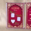 Close-up of the left page of the Nikah Nama booklet, showing gold foil names 'Ibrahim' and 'Hasiba' next to spaces for photos.