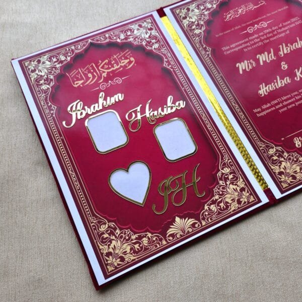 nn6 Angled perspective shot of the open Nikah Nama booklet, displaying the custom gold names and the marriage agreement page.