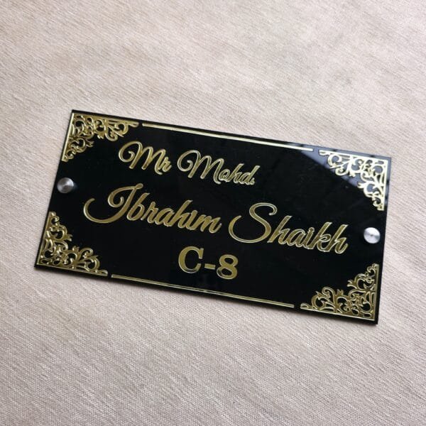 Top-down view of the custom acrylic nameplate on a textured beige surface, showcasing the full design and layout.