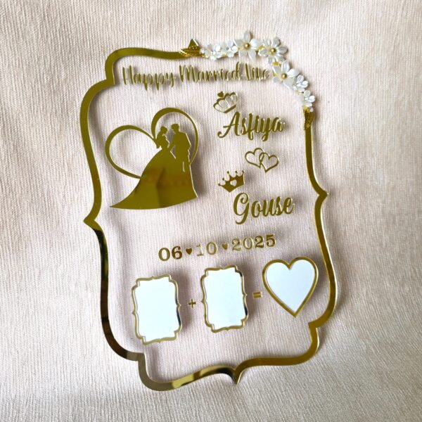 Personalized gold acrylic wedding thumb board featuring names 'Asfiya' and 'Gouse', wedding date '06-10-2025', a bride and groom silhouette, and spaces for thumbprints, set against a light beige textured background.