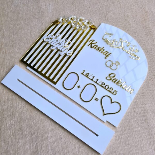 A disassembled view of the personalised engagement plaque and its white acrylic stand on a neutral background.