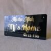 Angled perspective of the black and gold Mashallah nameplate, highlighting the reflective quality of the golden letters.