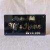 Direct front-on view of the Mashallah nameplate showing a clear reflection in the golden 'MJ's Home' text.
